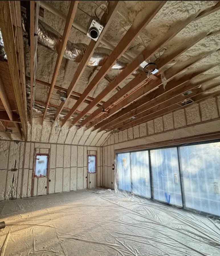 Interior walls and ceiling insulated with spray foam during new construction in Manvel